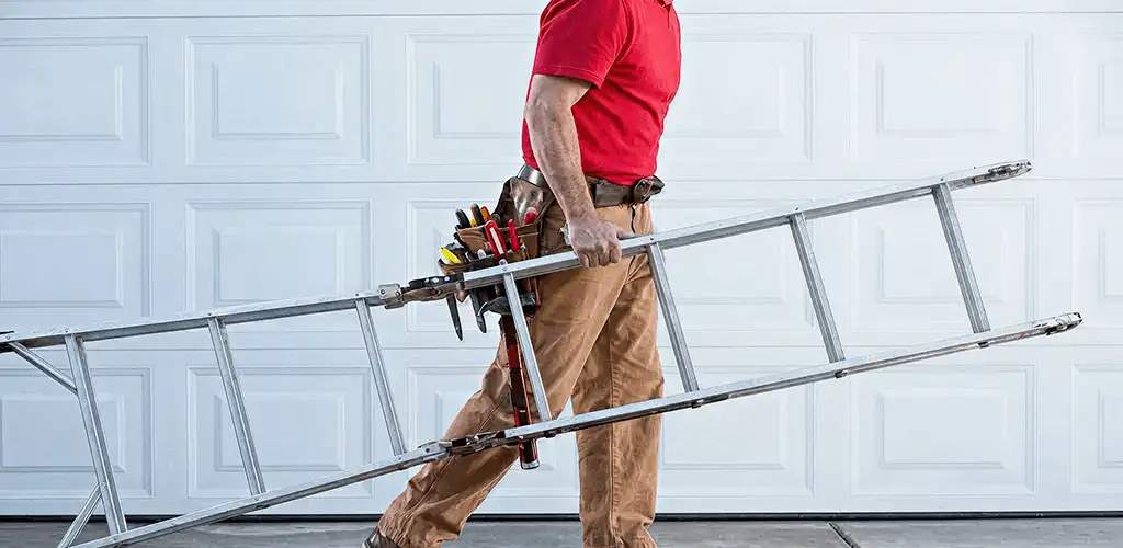 Garage door repair technician arriving with tools and ladder in Madison, WI
