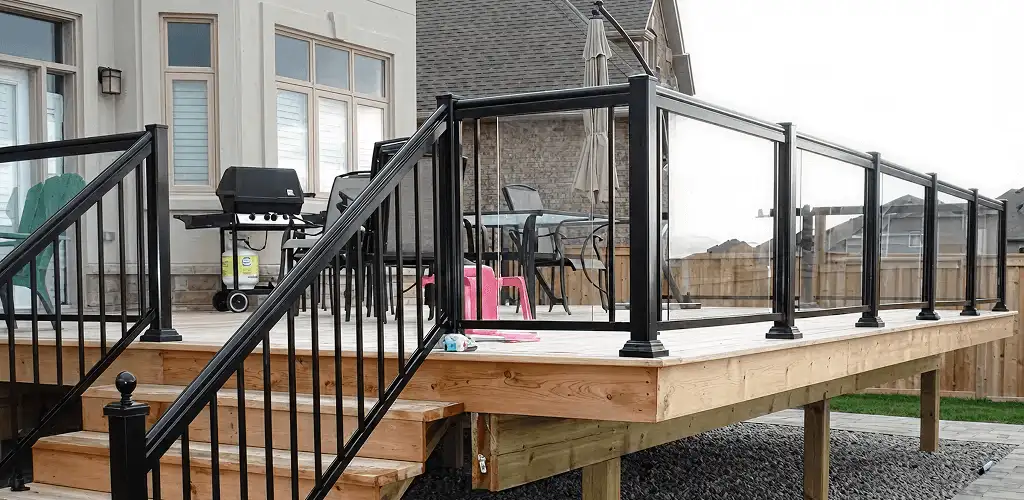 Handrail installation on a deck staircase for safety and code compliance in Madison, WI