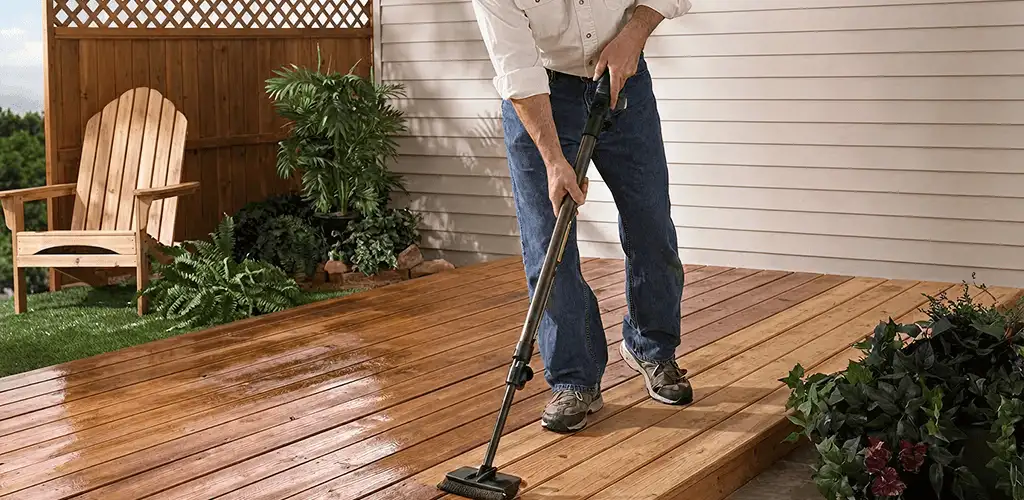 Deck staining service applying stain to a backyard wood deck in Madison, WI